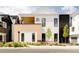 Stylish home exterior with brick and siding accents, landscaping, and address signage at 8260 E 36Th Ave # 29, Denver, CO 80238