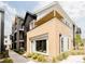 Modern condo exterior with brick accents, balconies, and landscaped grounds at 8260 E 36Th Ave # 29, Denver, CO 80238