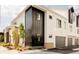 Modern exterior of the home with black accents and a two-car garage at 8260 E 36Th Ave # 29, Denver, CO 80238