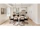 Contemporary kitchen with stainless steel appliances, island seating, and modern pendant lighting at 8260 E 36Th Ave # 29, Denver, CO 80238