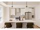 Sleek kitchen with white cabinets, stainless steel appliances, and a spacious island at 8260 E 36Th Ave # 29, Denver, CO 80238