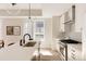 Bright kitchen with stainless steel appliances, white countertops, and modern lighting at 8260 E 36Th Ave # 29, Denver, CO 80238