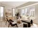 Inviting living room with large windows, contemporary furnishings, and ample sunlight at 8260 E 36Th Ave # 29, Denver, CO 80238