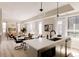 Open concept living space with kitchen, dining, and living areas, all well-lit at 8260 E 36Th Ave # 29, Denver, CO 80238