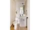 Charming powder room featuring light gray vanity, modern fixtures, and stylish decorative art at 8260 E 36Th Ave # 29, Denver, CO 80238