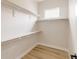 Spacious walk-in closet with custom shelving for efficient storage and organization at 8260 E 36Th Ave # 29, Denver, CO 80238