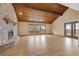 Bright living room with hardwood floors and access to deck at 6941 Hillridge Pl, Parker, CO 80134