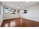 Spacious bedroom featuring wood floors, natural light, and a ceiling fan at 2 Viking Dr, Englewood, CO 80113