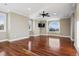 Large bedroom with a fan, hardwood floors, and windows offering outside views at 2 Viking Dr, Englewood, CO 80113
