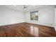 Bright bedroom featuring hardwood floors, a ceiling fan, and a window with natural light at 2 Viking Dr, Englewood, CO 80113