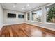 Bonus room with two televisions and lots of natural light at 2 Viking Dr, Englewood, CO 80113