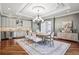 Elegant dining room boasts wood floors, designer lighting, and plenty of space for entertaining guests at 2 Viking Dr, Englewood, CO 80113