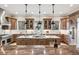Gourmet kitchen with granite countertops, stainless steel appliances, and custom cabinetry at 2 Viking Dr, Englewood, CO 80113