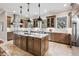 Gourmet kitchen with a large island, stainless steel appliances, and plenty of cabinet space at 2 Viking Dr, Englewood, CO 80113