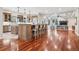 Expansive kitchen with island seating, connecting to an open-concept living area at 2 Viking Dr, Englewood, CO 80113