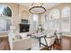 Spacious living room featuring a fireplace, large windows, and stylish seating at 2 Viking Dr, Englewood, CO 80113