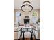 Stylish living room featuring hardwood floors, fireplace, and arched windows at 2 Viking Dr, Englewood, CO 80113