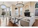 Well-appointed living room with tall windows, fireplace, and comfortable seating at 2 Viking Dr, Englewood, CO 80113