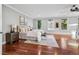 Spacious main bedroom with hardwood floors, and lots of natural light from the many windows at 2 Viking Dr, Englewood, CO 80113