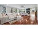 Large main bedroom with hardwood floors, seating area, fireplace and many windows at 2 Viking Dr, Englewood, CO 80113