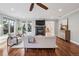 Bright bedroom area with hardwood floors and many windows and a ceiling fan at 2 Viking Dr, Englewood, CO 80113