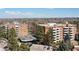 An attractive aerial view of two apartment buildings, parking, and trees on a sunny day at 2880 S Locust St # 708S, Denver, CO 80222