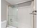 Bathroom with a shower and tub combination with sliding glass doors at 2880 S Locust St # 708S, Denver, CO 80222