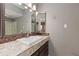 Bathroom featuring granite countertops and a large decorative mirror at 2880 S Locust St # 708S, Denver, CO 80222