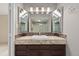 Bathroom featuring a granite countertop and a decorative triptych mirror at 2880 S Locust St # 708S, Denver, CO 80222
