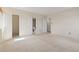 Bedroom featuring neutral carpet and multiple doors, including closet and bathroom at 2880 S Locust St # 708S, Denver, CO 80222
