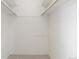 Walk-in closet featuring carpet flooring, shelves, and hanging rods at 2880 S Locust St # 708S, Denver, CO 80222