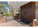 An inviting entrance with double doors, a bench, and professionally installed brick walkway at 2880 S Locust St # 708S, Denver, CO 80222