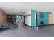 Community fitness center with modern equipment and motivating wall art for residents' health and wellness at 2880 S Locust St # 708S, Denver, CO 80222