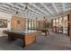 Community game room featuring pool tables and a ping pong table for entertainment and recreation at 2880 S Locust St # 708S, Denver, CO 80222