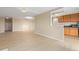 Bright living room featuring hardwood floors, neutral walls, and an open concept to the kitchen at 2880 S Locust St # 708S, Denver, CO 80222