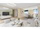 Bright living room features a mirrored wall, dining area and balcony access at 2880 S Locust St # 708S, Denver, CO 80222