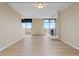 Living room with brick accent wall, fireplace and balcony access at 2880 S Locust St # 708S, Denver, CO 80222