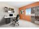 Home office featuring neutral carpet, a large window, and custom shelving at 2880 S Locust St # 708S, Denver, CO 80222