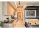 Modern studio kitchen with stainless steel appliances and wood cabinets at 603 Inca St # 528, Denver, CO 80204