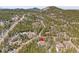 Aerial view of house nestled among trees, a great place to enjoy peace and quiet at 1189 Lodgepole Dr, Evergreen, CO 80439