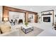 Spacious basement with stylish decor, furniture, fireplace and wood accents at 1189 Lodgepole Dr, Evergreen, CO 80439