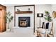 Close up on Basement fireplace with stylish decor, plants, and rustic touches at 1189 Lodgepole Dr, Evergreen, CO 80439