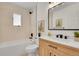 Bathroom features modern fixtures and vanity, as well as tub and shower at 1189 Lodgepole Dr, Evergreen, CO 80439