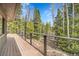 Expansive deck with beautiful view of trees and nature, perfect for outdoor entertaining and relaxation at 1189 Lodgepole Dr, Evergreen, CO 80439