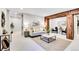 Bright living room featuring neutral paint, wood accents, stylish furniture and decor, and recessed lighting at 1189 Lodgepole Dr, Evergreen, CO 80439