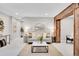 Inviting living area with neutral colors, light carpet, wood accents, recessed lighting, and comfortable seating at 1189 Lodgepole Dr, Evergreen, CO 80439