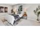 Main bedroom boasts large windows and stylish modern decor at 1189 Lodgepole Dr, Evergreen, CO 80439