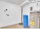 Functional utility room with water heater, storage, and ample space at 1189 Lodgepole Dr, Evergreen, CO 80439
