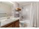 Clean bathroom featuring a vanity, toilet, and a shower/tub combo with white tile and a shower curtain at 2296 S Pitkin Way # A, Aurora, CO 80013