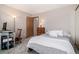 Bedroom with a bed, wooden desk, and neutral walls, offering a serene and functional living space at 2296 S Pitkin Way # A, Aurora, CO 80013